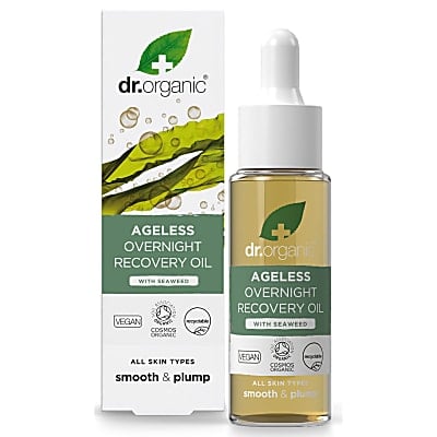 The Doctor Says A Quick Dip In The Sea Will Fix Any Wrinkles | Dr. Organic Seaweed Ageless Range A short cylindrical glass bottle full of some translucent golden yellow liquid with a white rubber pipette lid and a light green label that has Dr. Organic Seaweed Ageless Overnight Recovery Oil written in bright white writing and a picture of a dark green leaf with a white cross over it on it next to a short rectangular light green cardboard box that has Dr. Organic Seaweed Ageless Overnight Recovery Oil written in bright white writing on it, on a white background.