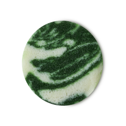 A Scrub Is A Guy That Can’t Get No Love From Me | Lush X Community Body Scrub 2025 Range | Gifted A medium circular puddle of some gradient dark green and white body scrub that has some pieces of Castor Sugar running through it, on a white background.