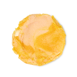 A medium circular puddle of some gradient golden caramel body scrub that has some pieces of Castor Sugar and Gold Lustre running through it, on a white background.
