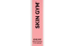 A tall rectangular bright pink cardboard box that has Skin Gym Eye Fit Brightening Eye Serum written in bold black writing on it, on a white background.