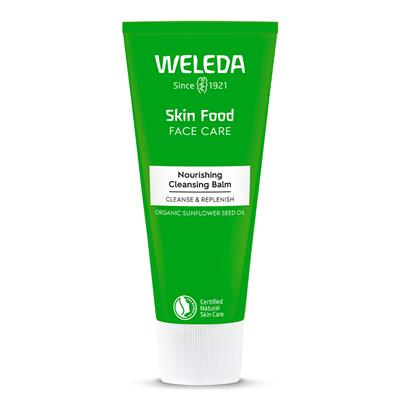 Well, Well, Well. Look Who Has Cleansed And Nourished Skin | Weleda Skin Food Nourishing Cleansing Balm A tall conical metallic green tube with a bright white plastic lid that has Weleda Skin Food Nourishing Cleansing Balm written in bright white writing on it, on a white background.
