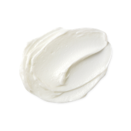 A medium circular puddle of some creamy white scalp treatment, on a white background.