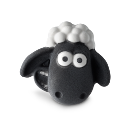 A medium creamy white sheep’s head shaped Bath Bomb that has a black face with some big eyes, a wide smile, and some floppy ears engraved on it and a bundle of creamy white wool on top of it’s head, on a white background.