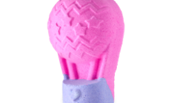 A medium bright pink hot-air balloon shaped bath bomb that has some stars engraved on it attached to a bright purple basket that has a bright pink heart engraved on it, on a white background.
