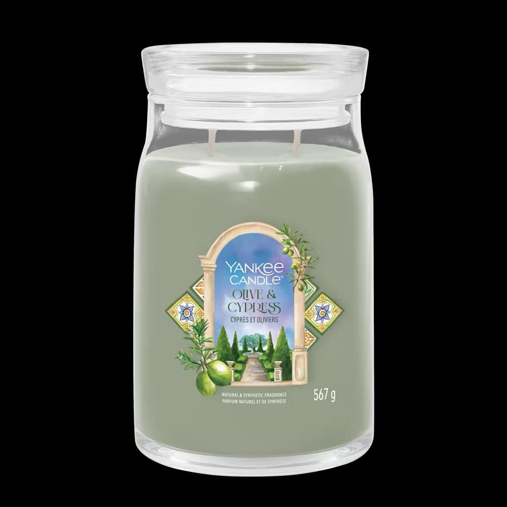 What I Thought of the Yankee Candle Advent House 2014 A tall cylindrical glass jar full of some pale green wax with a label that has Yankee Candle written in bright white writing, Olive & Cypress written in bright white writing, and a picture of some large dark green Olive & Cypress Trees on it, on a white background.