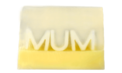 A medium bright yellow rectangular shaped block of soap that has the word Mum engraved on it, on a white background.