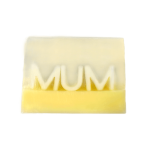 A medium bright yellow rectangular shaped block of soap that has the word Mum engraved on it, on a white background.