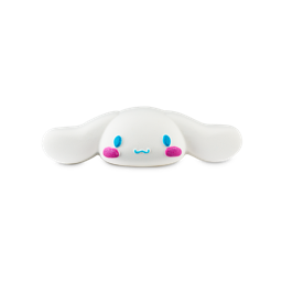 A medium elongated bright white puppy’s head shaped bath bomb that has some long white ears, some bright blue eyes, a small bright blue mouth, and some rosy red cheeks engraved on it, on a white background.