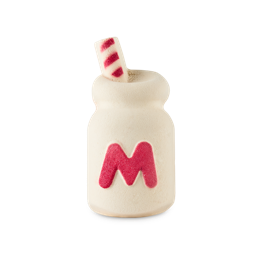 A medium bright white glass of milkshake shaped bubble bar that has a tall bright red and white straw coming out of the top of it and a large bright red letter m engraved on it, on a white background.