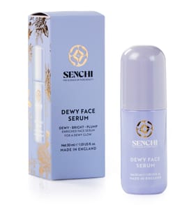 Luckily I Had The Foresight To Pick Them Up Before They Were Gone | Senchi Dewy Range A tall cylindrical light purple glass bottle with a light purple plastic lid that has Senchi Dewy Face Serum written in bright white writing on it next to a tall rectangular light purple cardboard box that has Senchi Dewy Face Serum written in bright white writing on it, on a white background.