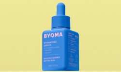 A short square bright blue plastic bottle with a bright blue rubber pipette lid that has Byoma written in bright pink writing and Hydrating Serum written in bright white writing on it, on a pastel yellow background.