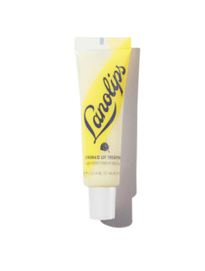 A short and thin conical bright white plastic Tube with a bright white Plastic Lid that has Lanolips written in dark blue writing, Lemonade Lip Treatment written in bold black writing, a picture of a bright yellow slice of Lemon, and a picture of a bright yellow stripe on it, on a white background.