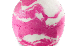 A medium gradient bright pink and white rounded hexagonal shaped bath bomb that has a swirling pattern all over it, on a white background.