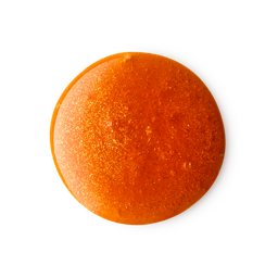 A medium circular puddle of some translucent dark orange shower gel that has some bright gold lustre running through it, on a white background.