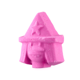 A small bright pink Witch’s Head shaped Bath Bomb that has some straight Hair, a large nose and a pointed hat with a Star on it engraved on it, on a white background.
