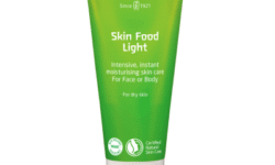 A tall conical metallic green tube with a bright white plastic lid that has Weleda Skin Food Light written in bright white writing on it, on a white background.