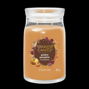 A tall cylindrical glass jar full of some bright orange wax with a label that has Yankee Candle written in bright white writing, Golden Pumpkin written in bright white writing, and a picture of some bright orange pumpkins, some golden orange leaves, and some Cinnamon Sticks on it, on a black background.