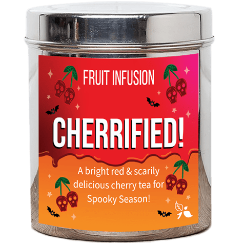 Tea Tastes Terrific | Bird & Blend Tea Company Halloween 2025 Collection A tall cylindrical gradient bright orange and red metal tin with a bright silver lid and a gradient bright orange and red label that has Cherrified Fruit Infusion written in bright white writing and some pictures of some cartooned bright red cherries with some bright green stems on it, on a white background.