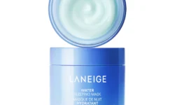 A short cylindrical gradient bright blue and dark blue plastic tub full of some creamy bright blue liquid with a bright blue plastic lid that has Laneige Water Sleeping Mask written in bright white writing on it, on a white background.