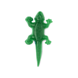 A small bright green lizard shaped block of Facial Gummy Wash that has some bright silver lustre all over it, on a white background.