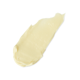 Mama's Hands Raised Up High | Lush Hemp Hand Cream A medium elongated smear of some thick, glossy ivory hand cream, on a white background.