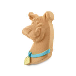 Scooby-Dooby-Do, Where Are You? | Lush x Scooby-Doo™ Range | Gifted A large dark brown Great Dane’s Head shaped bath Bomb that has a cheeky smile and a bright Blue Dog Collar with a bright gold name tag engraved on it, on a white background.