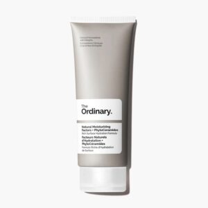 A tall flat conical matte grey plastic tube with a frosted white plastic lid that has The Ordinary Natural Moisturising Factors + Phytoceramides written in bold black writing on it, on a white background.