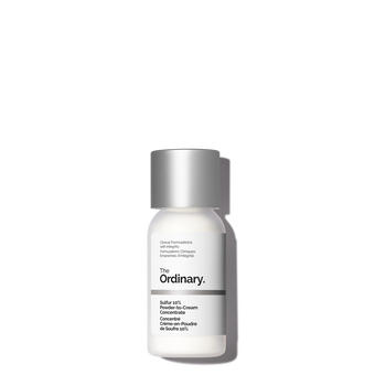 Digging Through A Sulfur Mine To Get Clearer-Looking Skin | The Ordinary Sulfur 10% Powder-To-Cream Concentrate A short cylindrical bright white plastic bottle with a matte silver plastic lid that has The Ordinary Sulfur 10% Powder-To-Cream Concentrate written in bold black writing on it, on a white background.