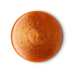 A medium circular puddle of some glossy dark green shower gel that has some bronze lustre running through it, on a white background.