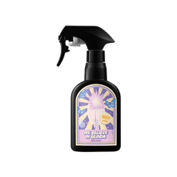 Because I Knew You, I Have Been Changed For Good! | Lush X Wicked : For Good Range A tall black plastic kitchen spray bottle with a gradient bright pink and purple label that has Lush We Believe In Glinda Body Spray written in bright white writing with a black outline around it and some pictures of some bright white sunbeams, some fluffy white clouds, a bright white unicorn's Horn, some dark blue stars, and a bright yellow star on it, on a white background.