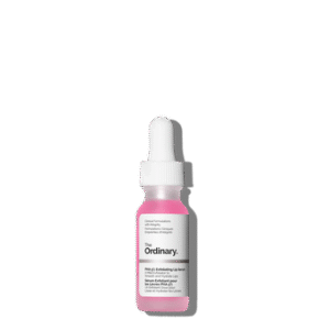 A short cylindrical dark brown glass bottle full of some translucent bright pink liquid with a bright white rubber pipette lid and a bright white label that has The Ordinary PHA 5% Exfoliating Lip Serum written in bold black writing on it, on a white background.