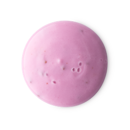 A medium circular swatch of some thick, creamy bright pink shower gel that has some Raspberry Seeds running through it, on a white background.