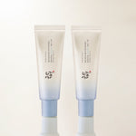 The Beauty Of Fresh Korean Suncare | Beauty Of Joseon Relief Sun Aqua Fresh Rice + B5 SPF50+ PA++++ A tall and thin gradient bright blue and white conical plastic tube with a light blue plastic lid that has Beauty of Joseon Relief Sun Aqua Fresh Rice + B5 SPF50+ PA+++++ written in bold black writing on it next to a tall and thin gradient bright blue and white conical plastic tube with a light blue plastic lid that has Beauty of Joseon Relief Sun Aqua Fresh Rice + B5 SPF50+ PA+++++ written in bold black writing on it, on a white background.