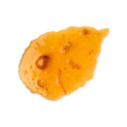 A medium circular swatch of some thick, glossy translucent bright orange body wash that has some pieces of Orange Peel and Orange Pulp running through it, on a white background.