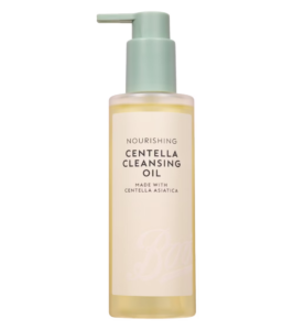 A tall cylindrical clear plastic bottle full of some pale yellow cleansing oil with a bright mint green plastic pump lid that has Boots Cleansing Oil written in bold black writing on it, on a white background.