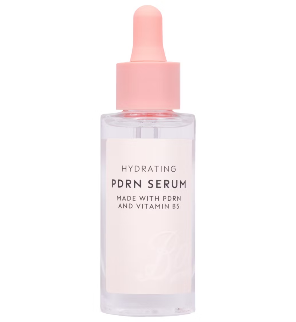 A short rounded rectangular glass bottle full of some clear Facial Serum with a light pink rubber pipette lid and a white label that has Boots Hydrating PDRN Serum written in bold black writing on it, on a white background.
