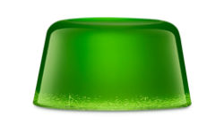 A short cylindrical glossy, translucent bright emerald green block of shower jelly that has some small air bubbles running through it, on a white background.