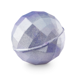Kiss All The Time. Disco, Occasionally | Lush Bathe All The Time Bath Bomb A medium bright lilac purple faceted spherical disco ball shaped bath bomb that has some bright purple lustre all over it, on a white background.