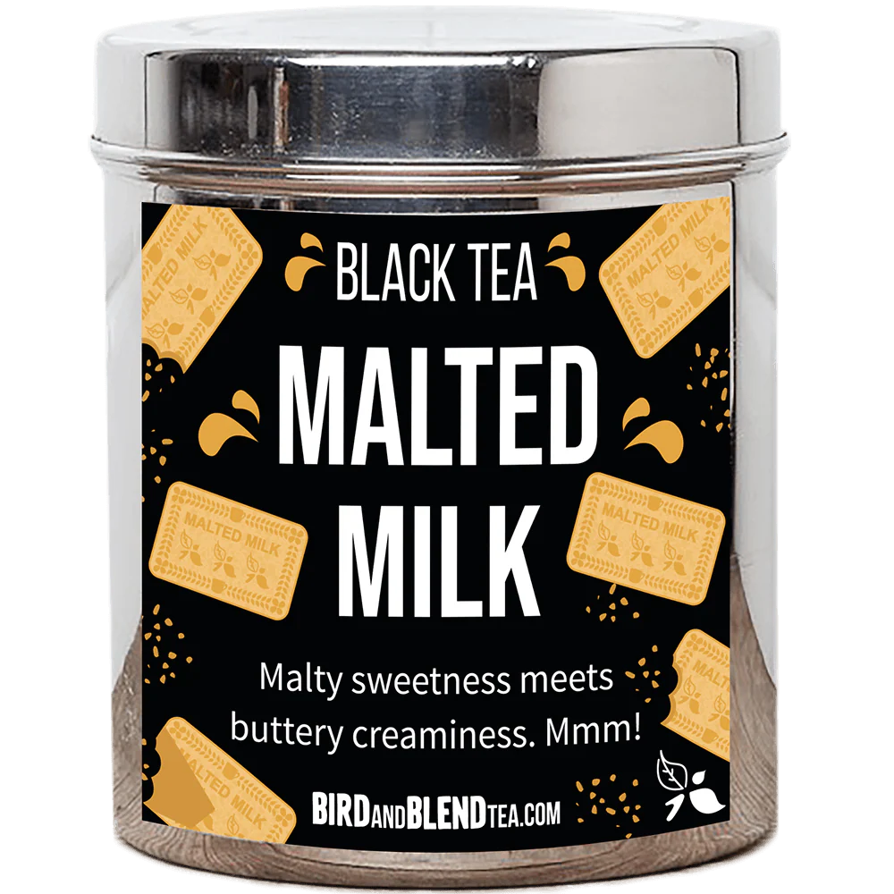 A tall cylindrical bright silver metal tin with a bright silver metal lid and a black label that has Malted Milk loose Leaf Tea written in bright white writing and some pictures of some golden brown rectangular malted milk biscuits on it, on a white background.