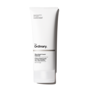 A tall tapered conical bright white plastic tube with a translucent bright white plastic lid that has The Ordinary Glycolipid Cream Cleanser written in bold black writing on it, on a white background.