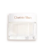 It's The Magical Power Of Water, Darlings! | Charlotte Tilbury Charlotte's Magic Water Cream A short rounded square clear glass jar full of some thick creamy white liquid with a metallic white lid and a white label that has Charlotte Tilbury Charlotte’s Magic Water Cream written in bright Rose Gold writing on it, on a white background.
