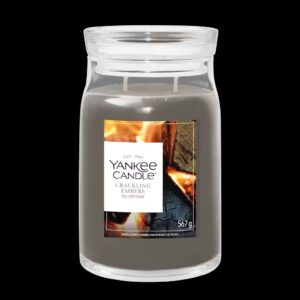 A tall cylindrical glass Jar full of some pale Grey Wax with a bright white label that has Yankee Candle written in bold black writing, Crackling Embers written in bold black writing, and a picture of some burning kindling and some bright red, orange and yellow glowing embers on it, on a black background.