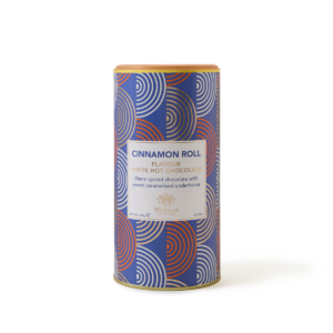 A tall dark blue cylindrical cardboard tube that has a light blue, orange and white concentric circle pattern all over it with a light tan brown plastic lid and a bright white label that has Whittard of Chelsea written in light tan brown writing, Cinnamon Roll written in dark blue writing, and White Hot Chocolate written in bright gold writing on it, on a white background.
